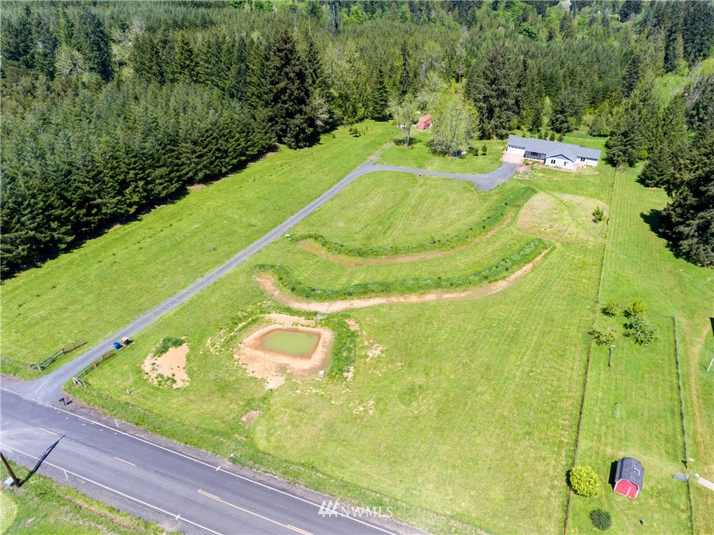 665 Rhoades Road Winlock, WA 98596 - Photo 38 of 39 a view of a swimming pool with a yard