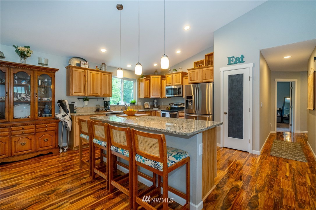 665 Rhoades Road Winlock, WA 98596 - Photo 10 of 39 a large kitchen with a table and chairs