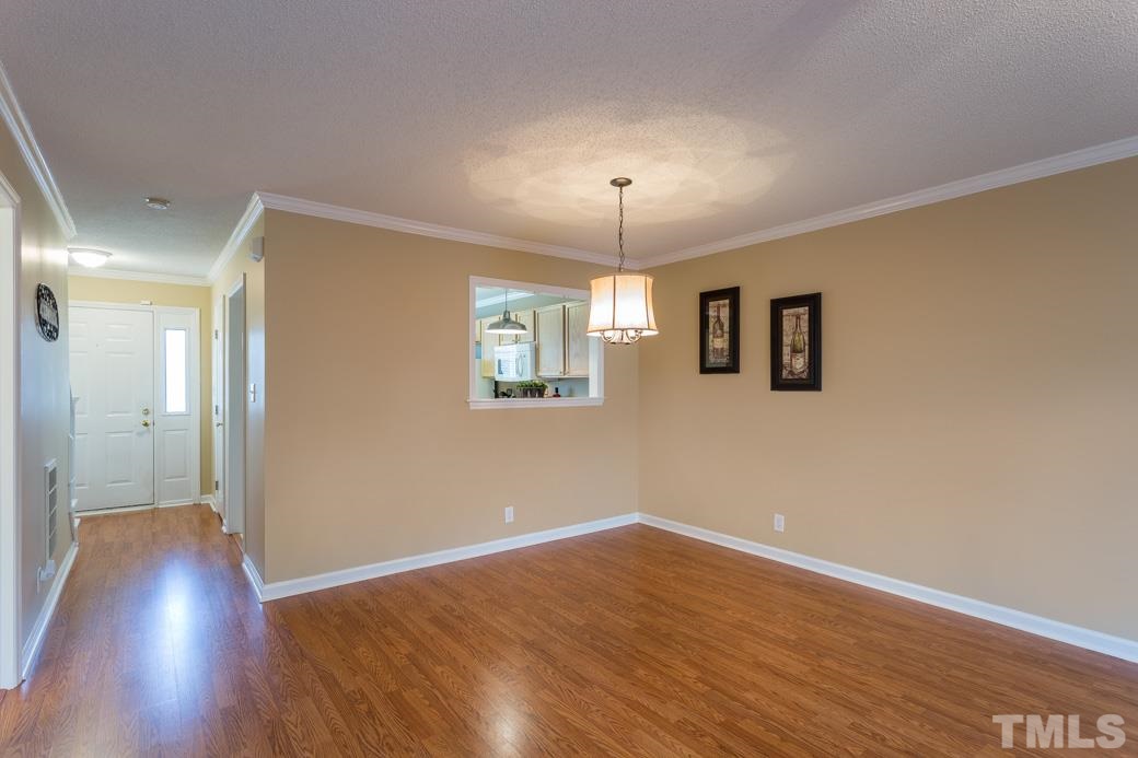 4416 Antique Lane Raleigh, NC 27616 - Photo 4 of 10 Large open area for the dining table with a nice transition to living room!