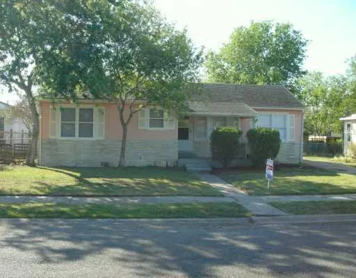 a view of a backyard of the house
