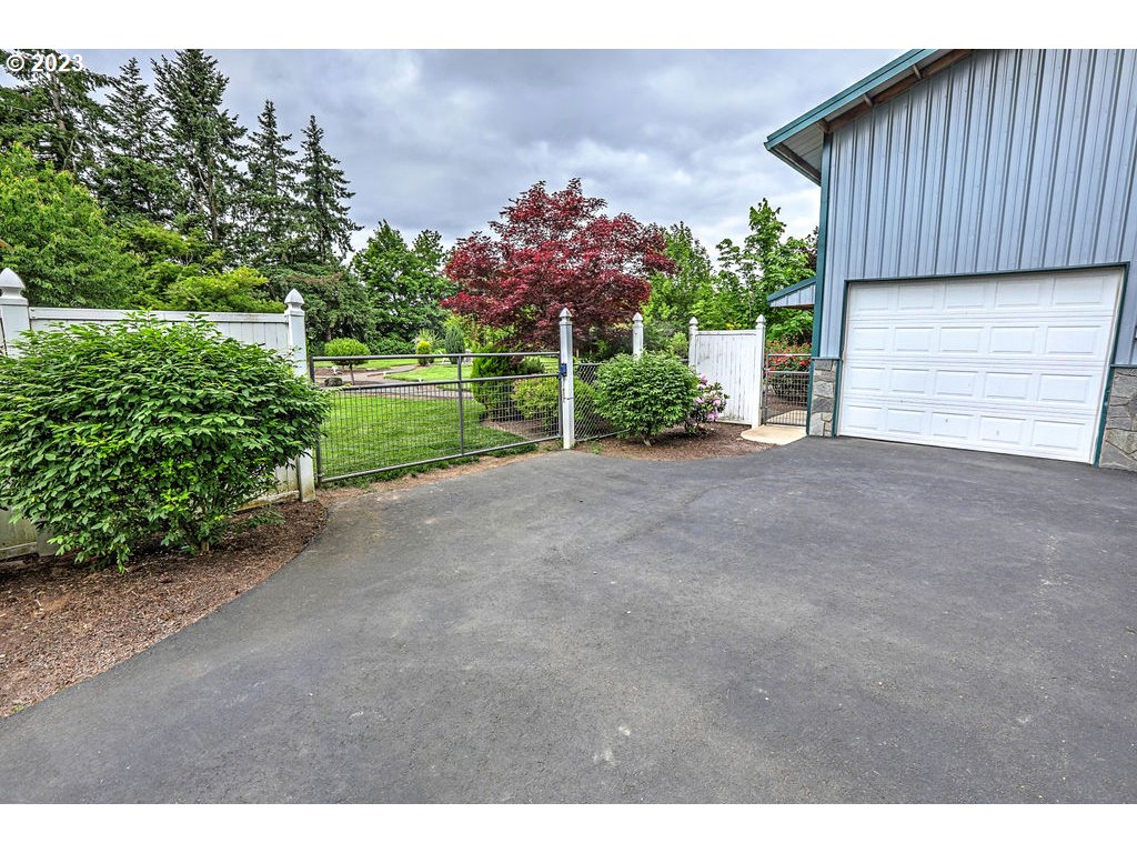 9625 South Barnards Road Canby, OR 97013 - Photo 5 of 39 a view of a house with a yard and garage