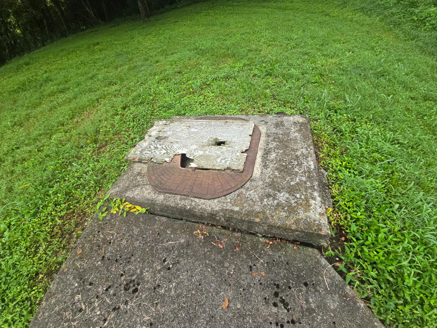 5143 North Hogan Road Aurora, IN 47001 - Photo 21 of 24 Existing cistern that has a pipe run to what was once a housing for a pump in the barn.