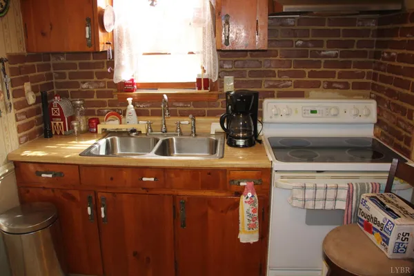 a kitchen with a stove and cabinets