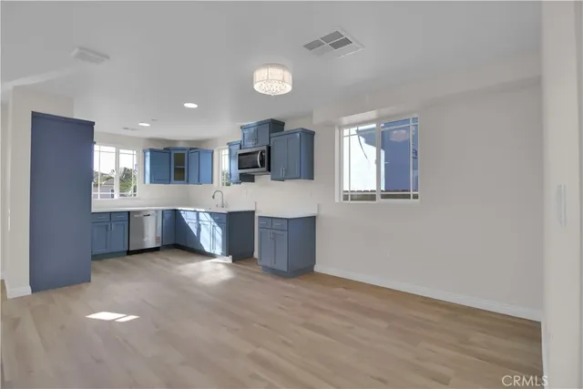 a view of kitchen and windows