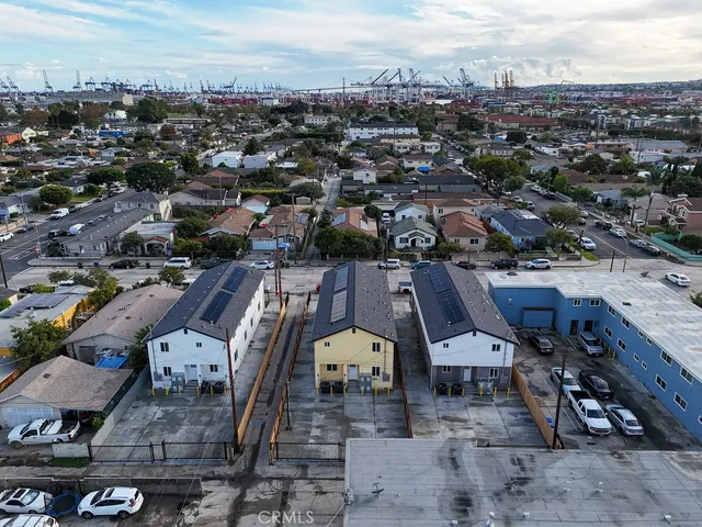 an aerial view of a house with a big yard