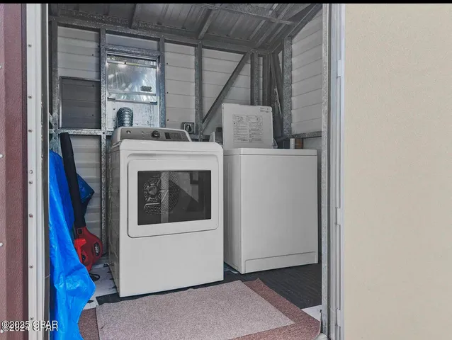 a utility room with dryer and washer