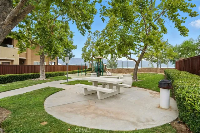 an aerial view of residential houses with yard and swimming pool