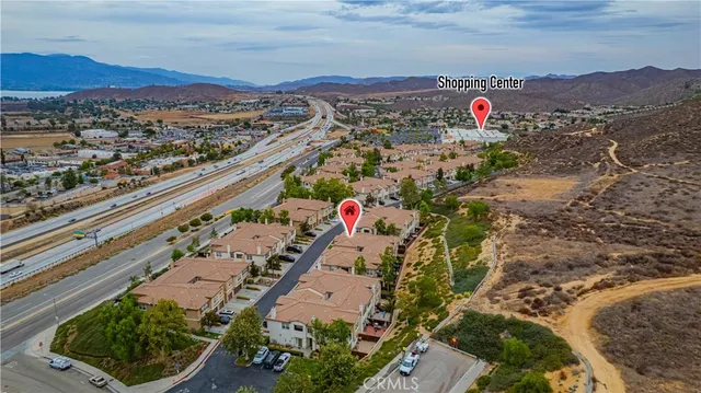 a view of a city with mountains in the background