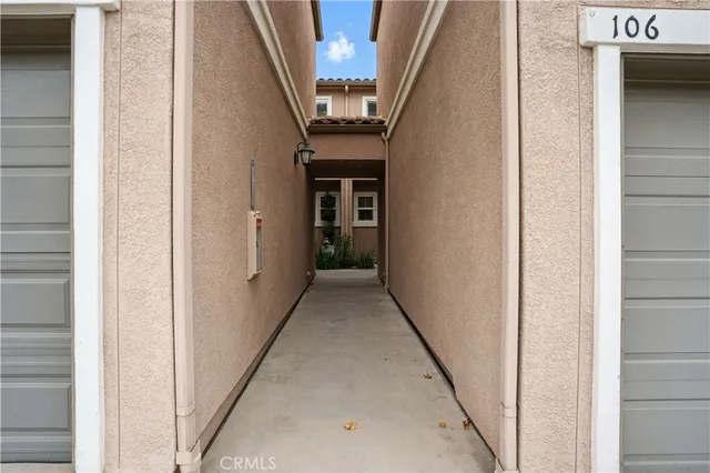 a view of a hallway with stairs