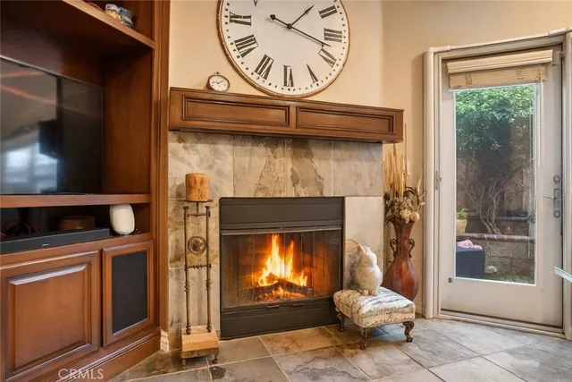 a view of a dining room with furniture and a fireplace