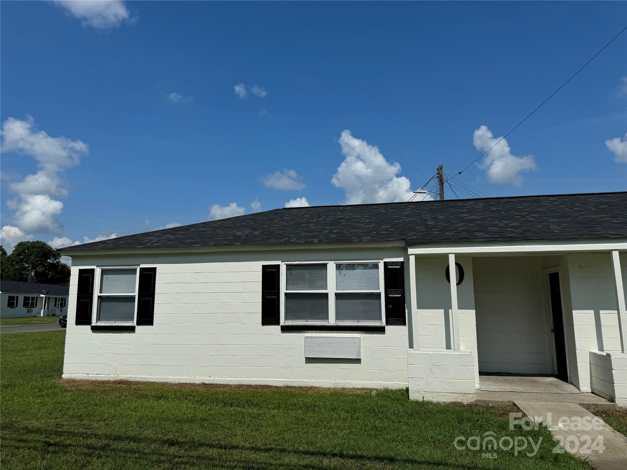 200 York Street, Unit O6 Chester, SC 29706 - Photo 1 of 13 a front view of a house with a yard