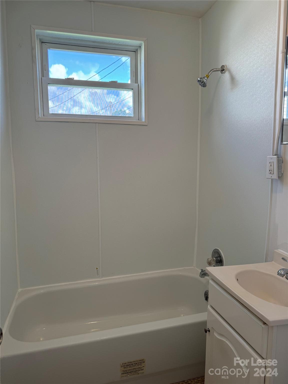 200 York Street, Unit O6 Chester, SC 29706 - Photo 11 of 13 a bathroom with a window and a shower