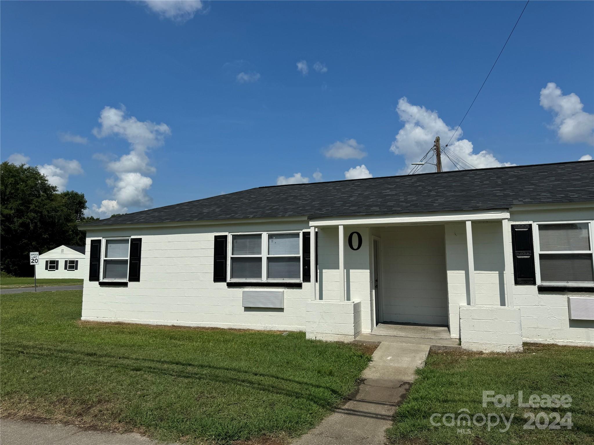 200 York Street, Unit O6 Chester, SC 29706 - Photo 2 of 13 a front view of a house with garden