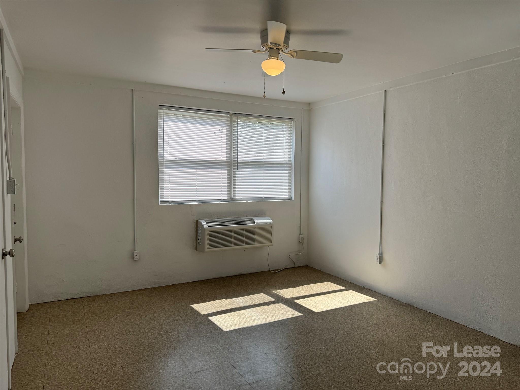 200 York Street, Unit O6 Chester, SC 29706 - Photo 3 of 13 an empty room with windows
