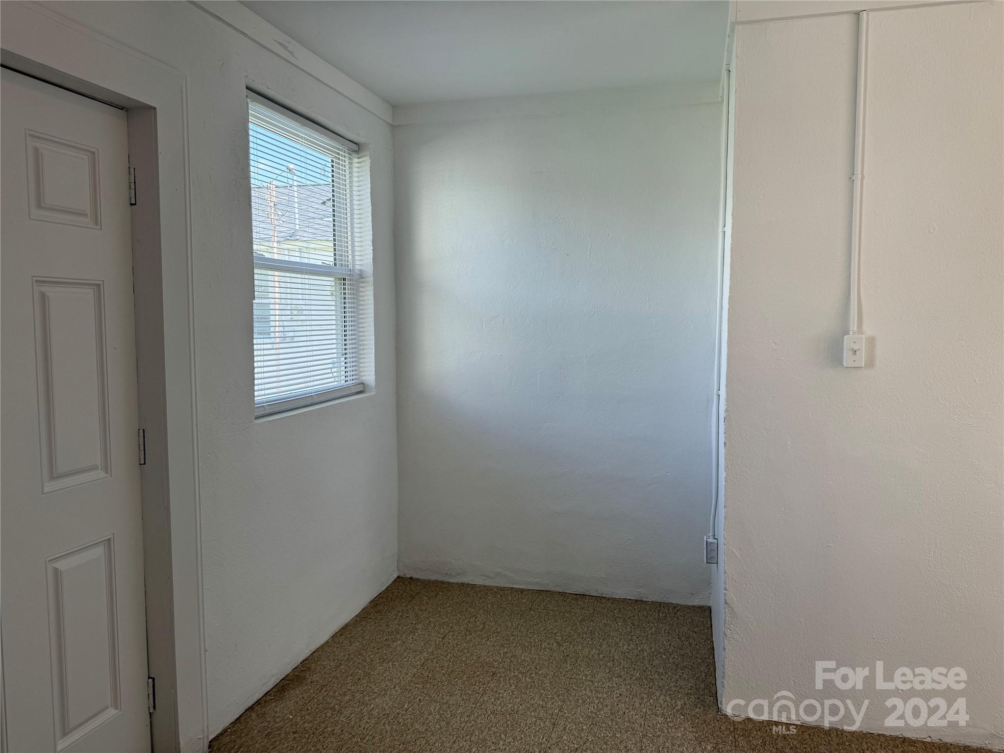 200 York Street, Unit O6 Chester, SC 29706 - Photo 6 of 13 an empty room with windows