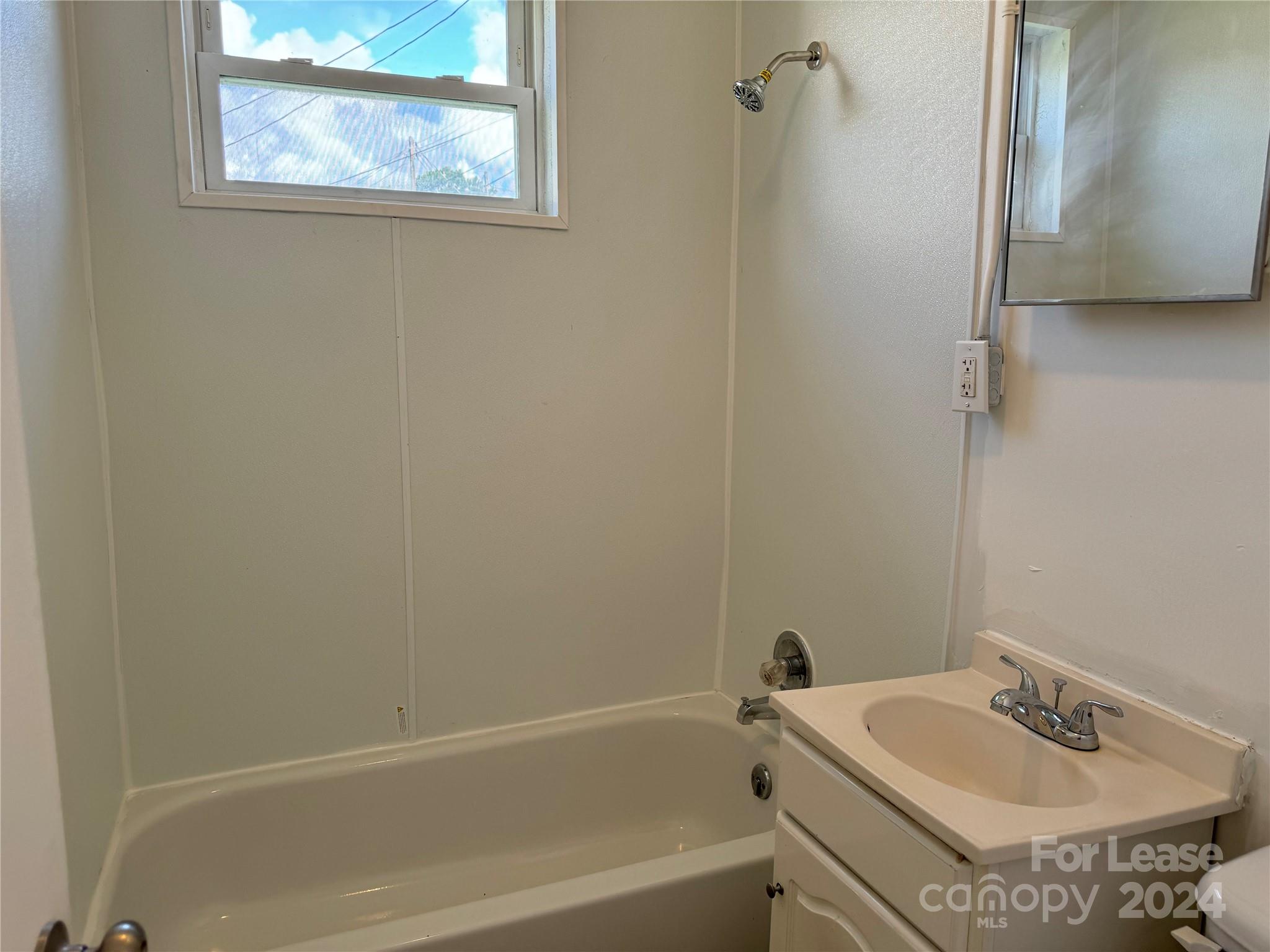 200 York Street, Unit O6 Chester, SC 29706 - Photo 10 of 13 a bathroom with a sink and a bathtub