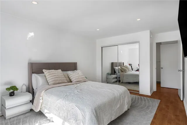 a bedroom with a bed and couch