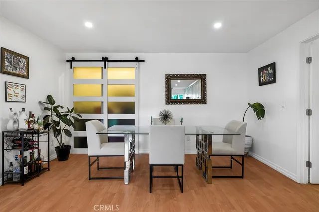a view of a livingroom with furniture and a window