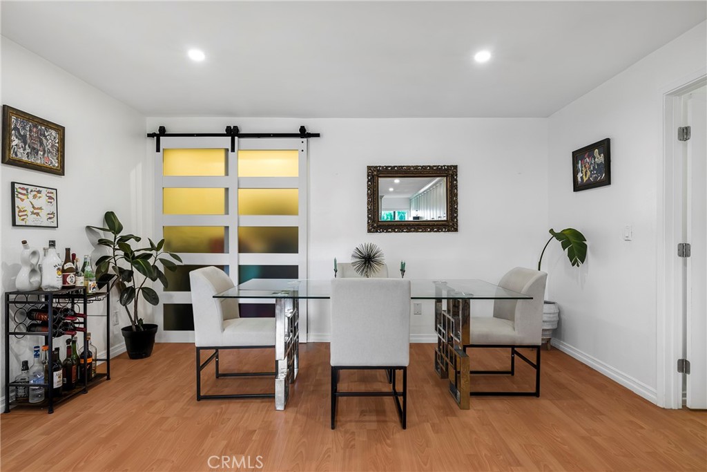 18530 Hatteras Street, Unit 213 Tarzana, CA 91356 - Photo 4 of 17 a view of a livingroom with furniture and a window