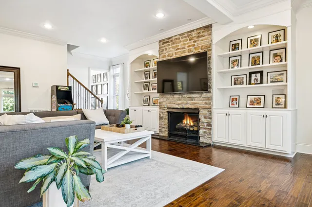 a large kitchen with stainless steel appliances granite countertop a lot of counter space and wooden floor