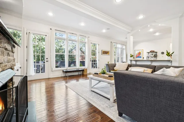 a kitchen with white cabinets and appliances