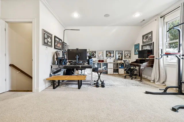a balcony with furniture and wooden floor