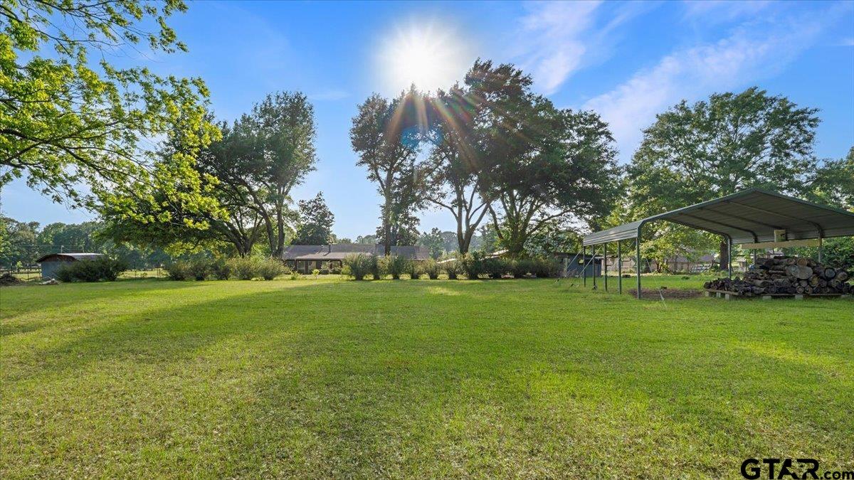 8192 County Road 428 Tyler, TX 75704 - Photo 2 of 38 a view of a field of grass and trees