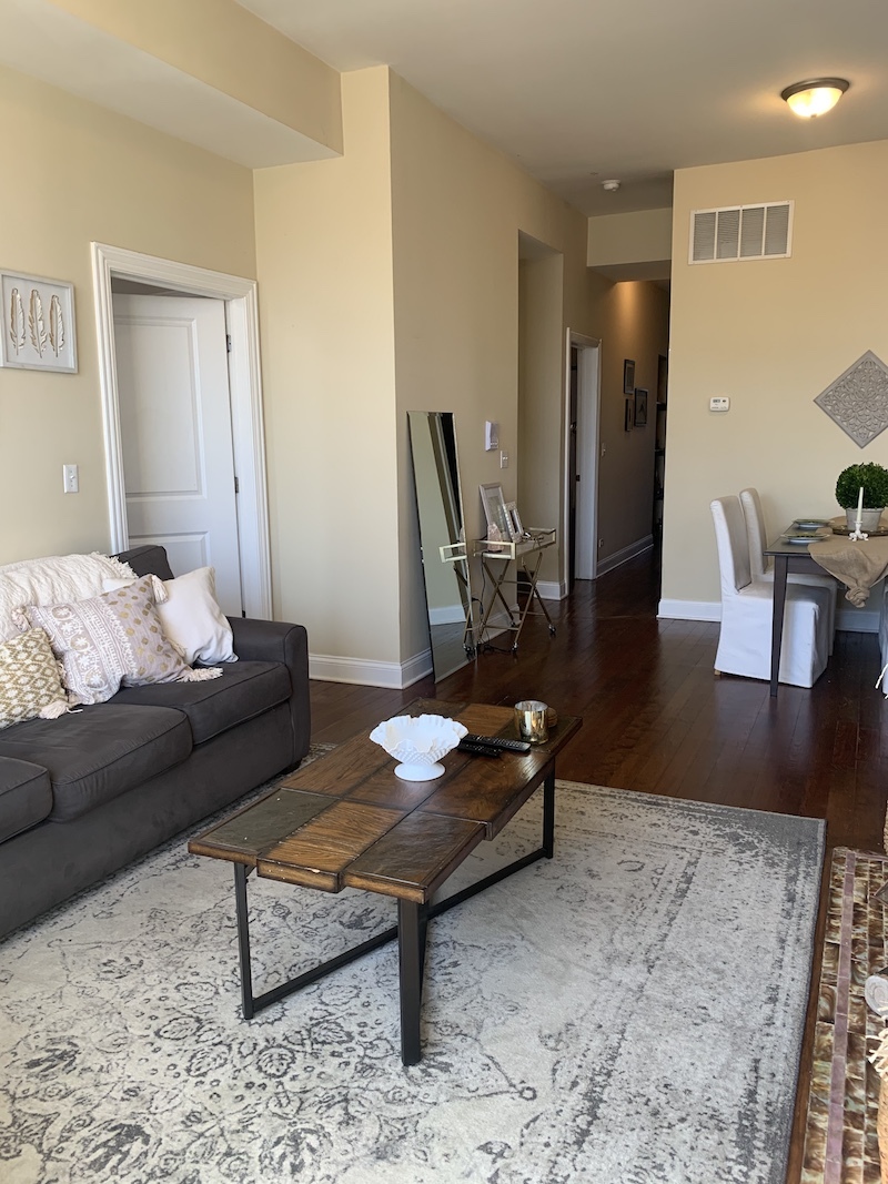 1740 West Huron Street, Unit 3F Chicago, IL 60622 - Photo 4 of 18 a living room with furniture and a wooden floor