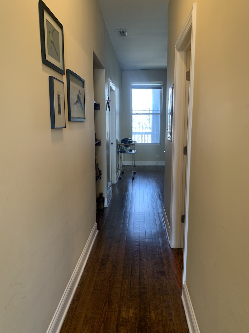 1740 West Huron Street, Unit 3F Chicago, IL 60622 - Photo 10 of 18 a view of a hallway with wooden floor and staircase