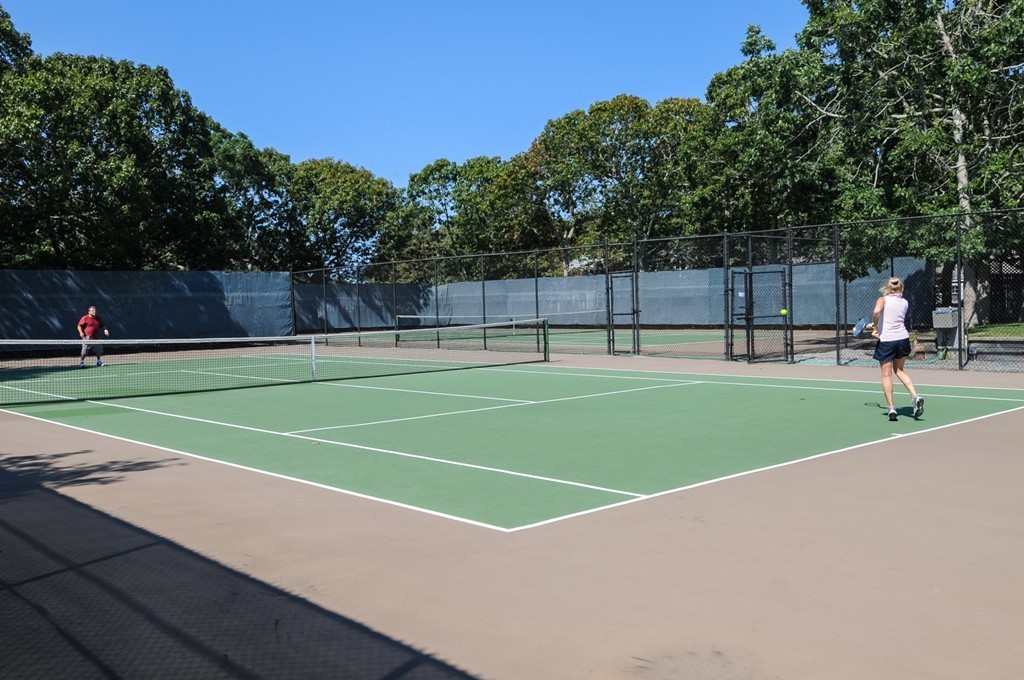 1 Belmont Road, Unit 223 West Harwich, MA 02671 - Photo 13 of 23 a view of a tennis ground with large trees