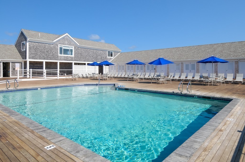 1 Belmont Road, Unit 223 West Harwich, MA 02671 - Photo 21 of 23 a view of a house with a yard and sitting area