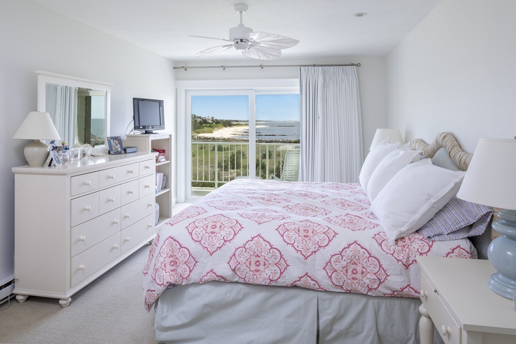 1 Belmont Road, Unit 223 West Harwich, MA 02671 - Photo 7 of 23 a bedroom with a large bed and a dresser