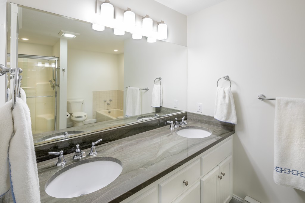 1 Belmont Road, Unit 223 West Harwich, MA 02671 - Photo 9 of 23 a bathroom with double vanity sinks and a mirror