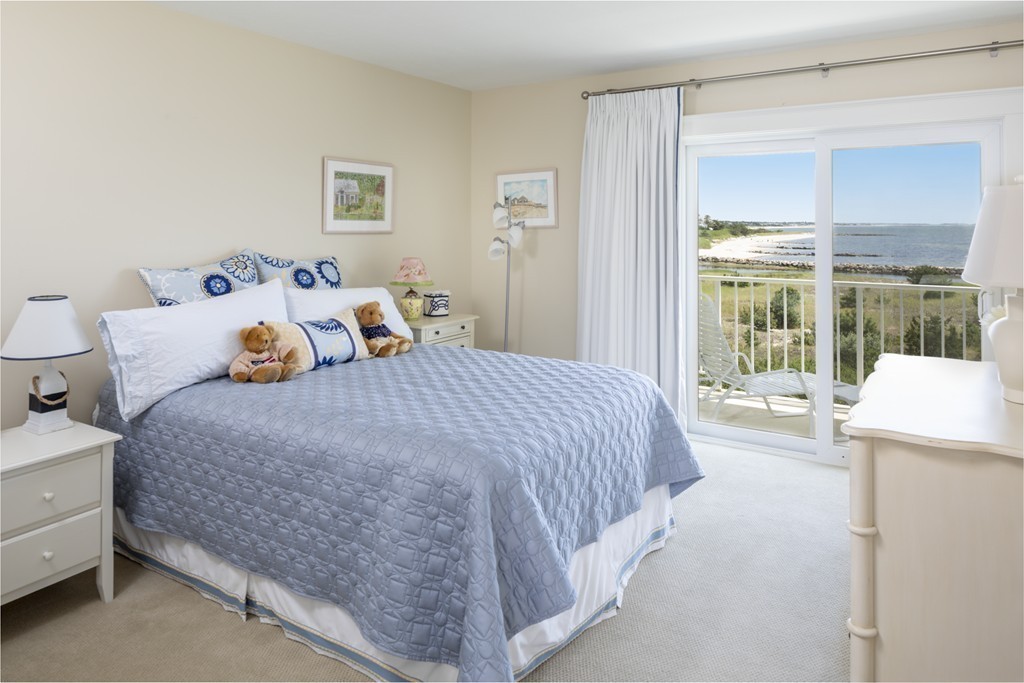 1 Belmont Road, Unit 223 West Harwich, MA 02671 - Photo 10 of 23 a bedroom with a bed and large window
