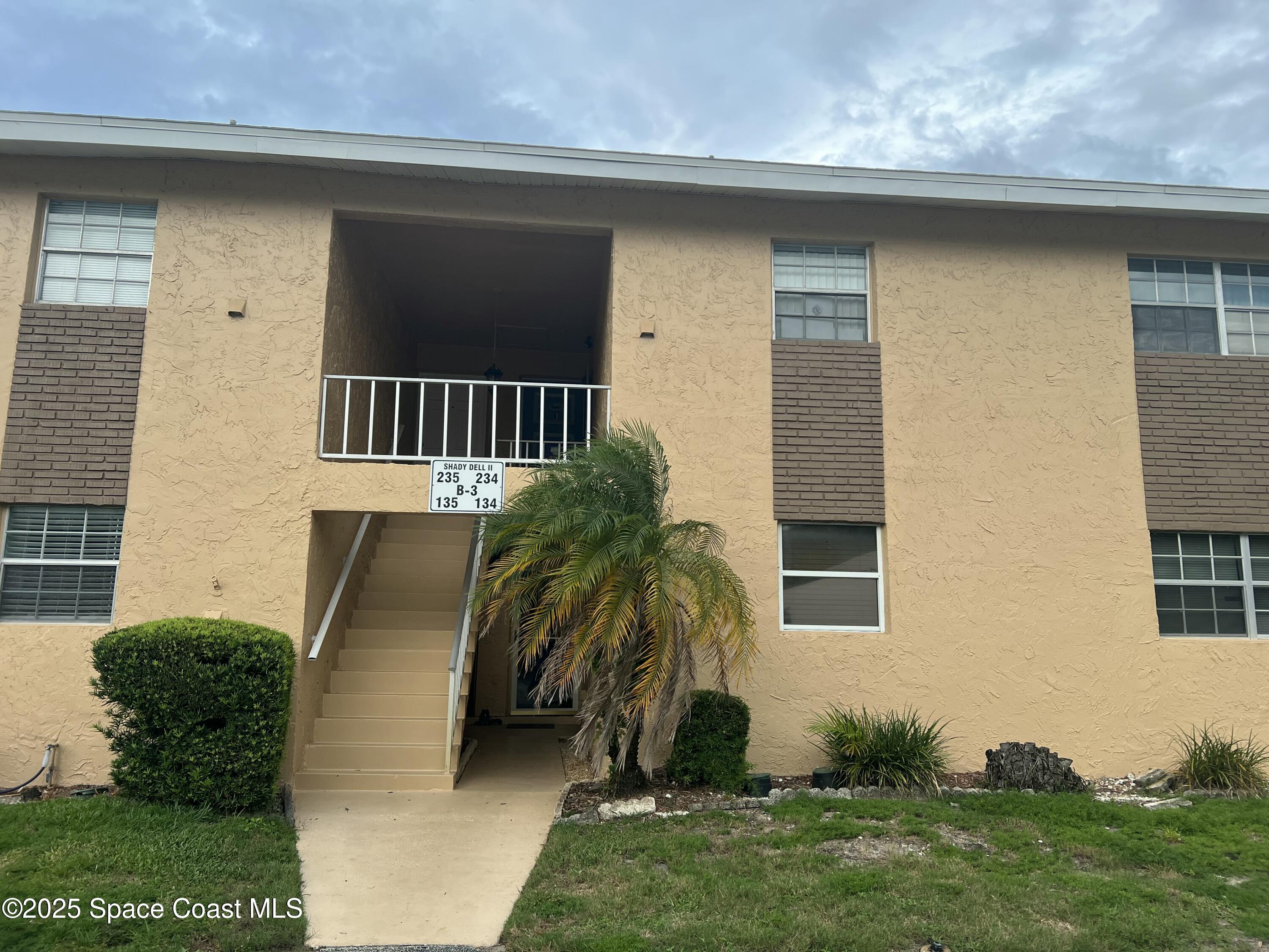 a view of backyard with barbeque grill and plants