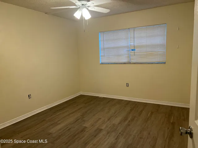 a bathroom with a sink mirror vanity and toilet