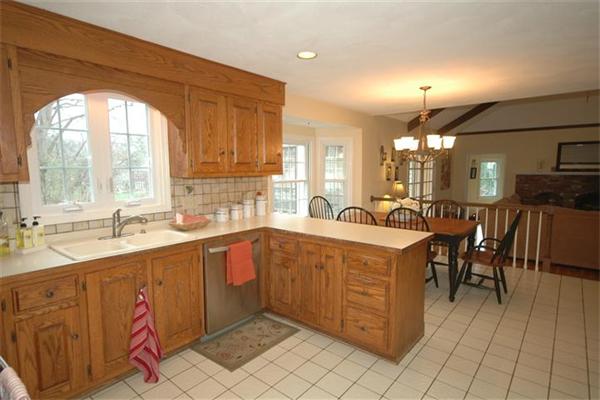 20 Porter Road Andover, MA 01810 - Photo 4 of 30 a large kitchen with kitchen island granite countertop a large island in the center