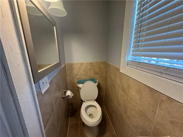a bathroom with a toilet and a sink