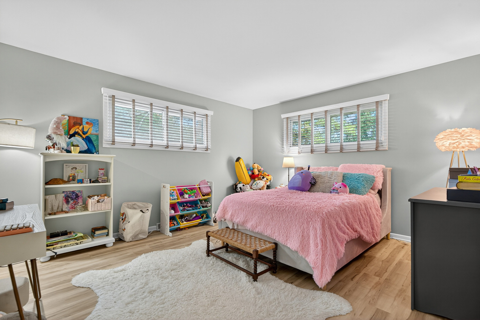 185 North Happ Road Northfield, IL 60093 - Photo 17 of 38 a bedroom with a bed a dresser and a book shelf