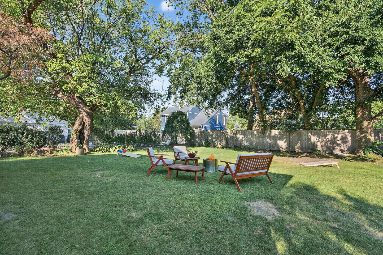 185 North Happ Road Northfield, IL 60093 - Photo 28 of 38 a backyard of a house with table and chairs