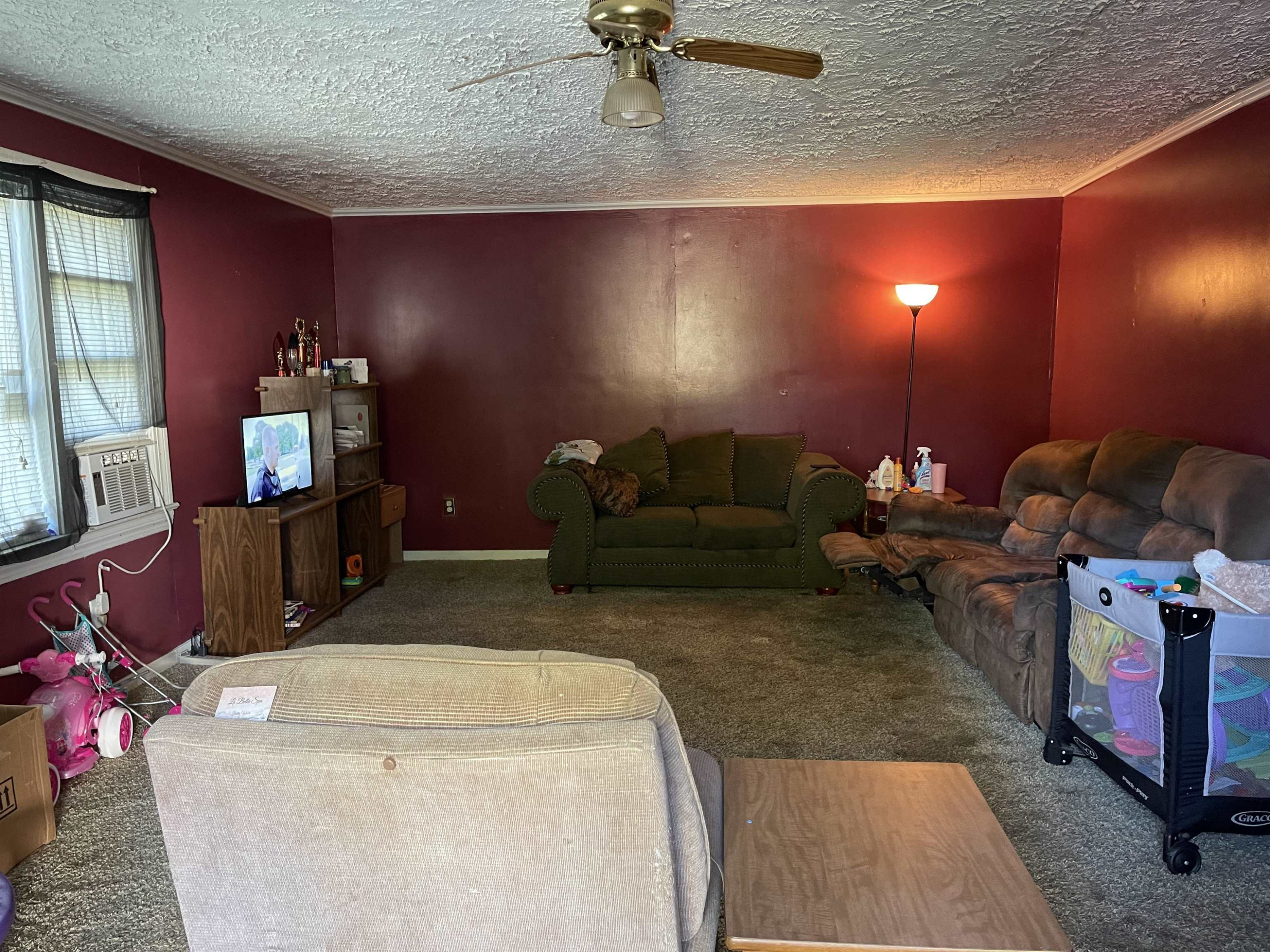 195 Old Denmark Road Jackson, TN 38301 - Photo 2 of 10 a living room with furniture and a flat screen tv