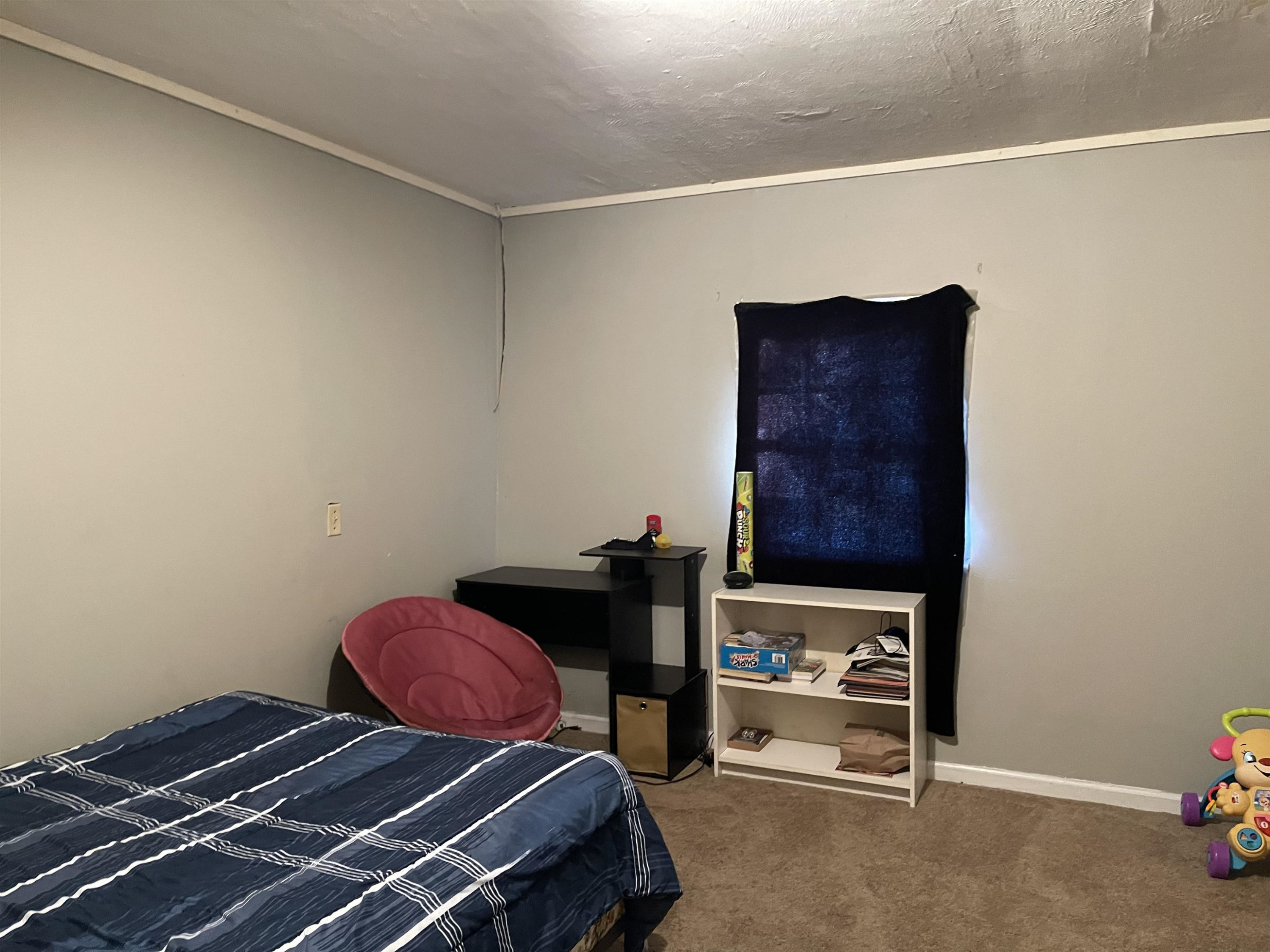 195 Old Denmark Road Jackson, TN 38301 - Photo 7 of 10 a bedroom with a bed and cabinets