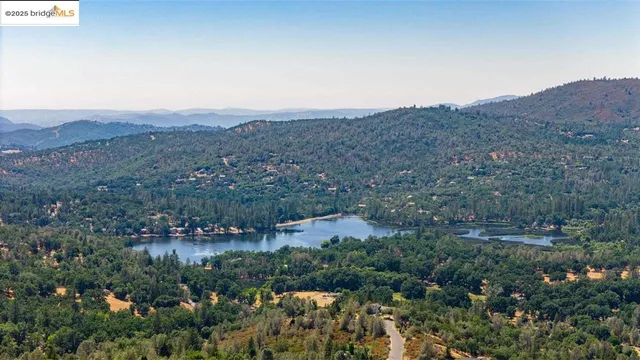 an aerial view of residential house and green space