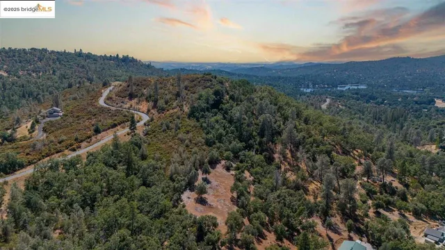 a view of a large building with a mountain in the background