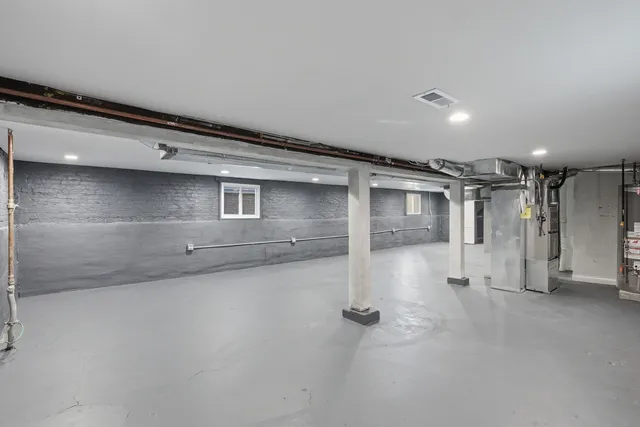 a view of a house with wooden fence