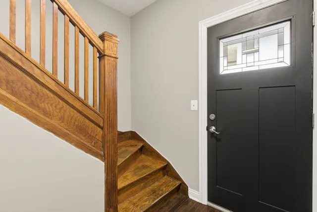 a view of staircase with railing and a stairs
