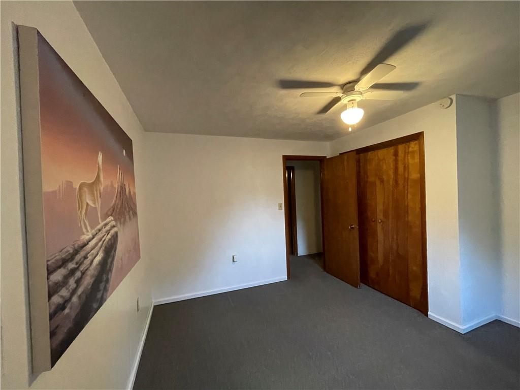 474 Iron Rock Road Waynesburg, PA 15370 - Photo 10 of 15 a view of a livingroom with a ceiling fan and window