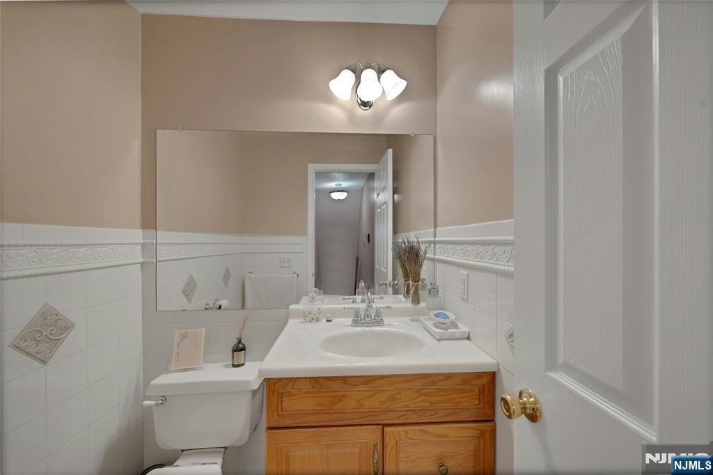 72 Marrow Street, Unit 3101 Newark, NJ 07103 - Photo 11 of 20 a bathroom with a sink and a mirror