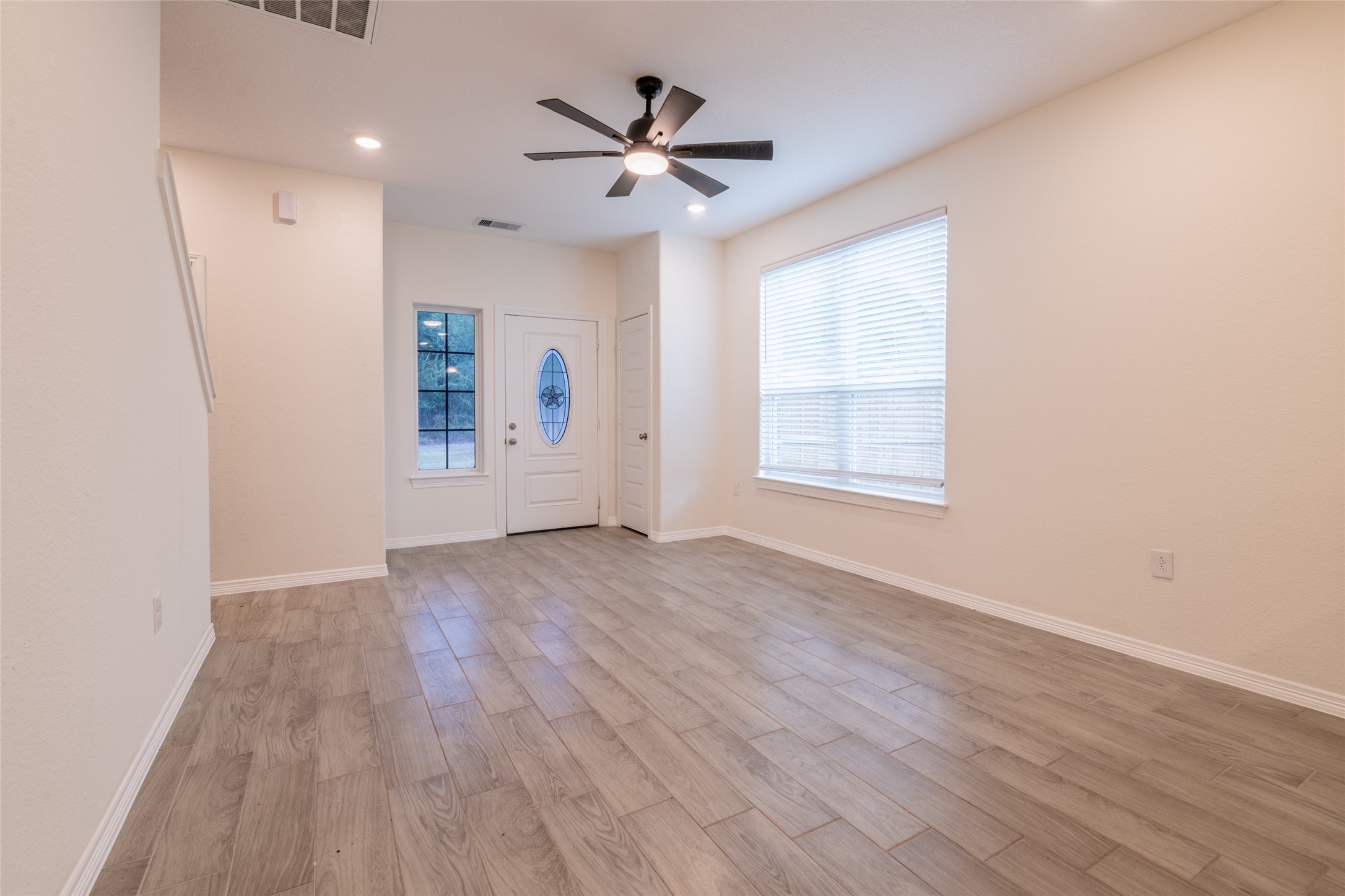 25012 Armagh Road Hempstead, TX 77445 - Photo 6 of 33 an empty room with wooden floor and windows