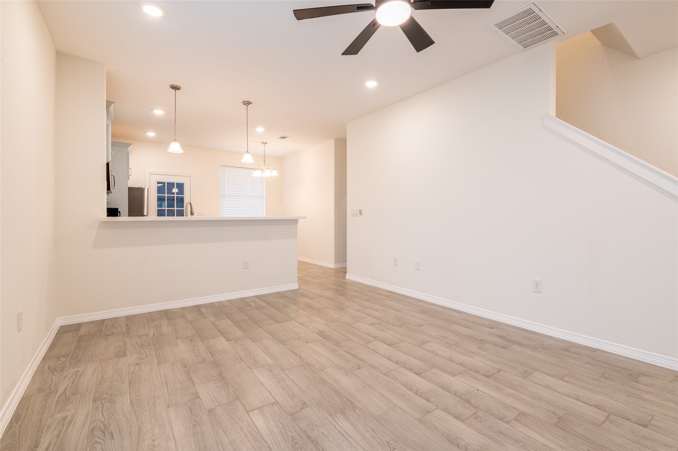 25012 Armagh Road Hempstead, TX 77445 - Photo 9 of 33 an empty room with wooden floor and windows